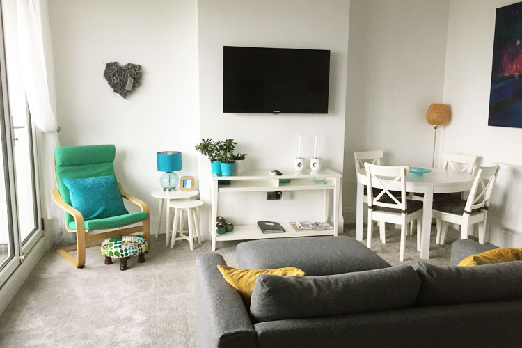 Living room with wall-mounted TV